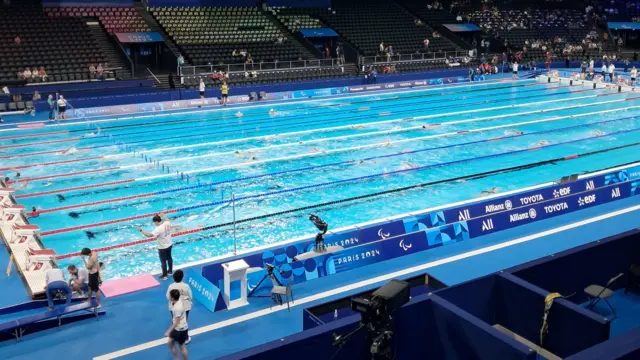 Swimmers warming up in La Defense Arena pool