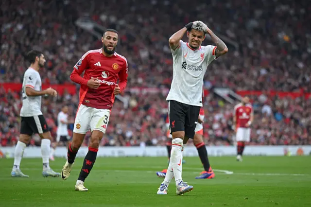 Luis Diaz of Liverpool reacts as Noussair Mazraoui of Manchester United looks on