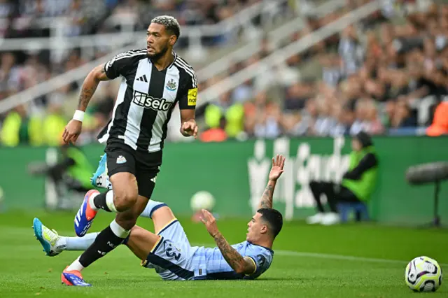 Joelinton (L) vies with Tottenham Hotspur's Spanish defender Pedro Porro