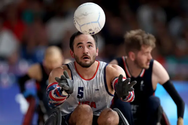 Chuck Aoki reaches out to catch the ball