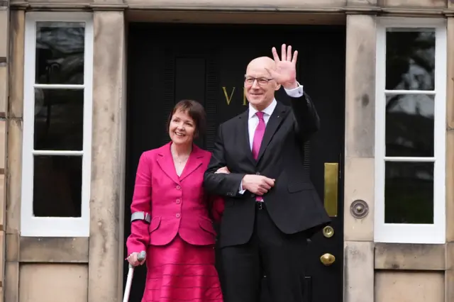 ohn Swinney, with his wife Elizabeth Quigley, on the steps of Bute House in Edinburgh