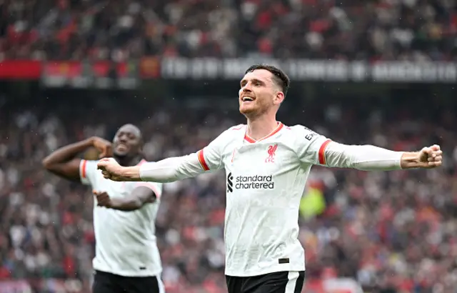 Andy Robertson of Liverpool celebrates after Mohamed Salah scores