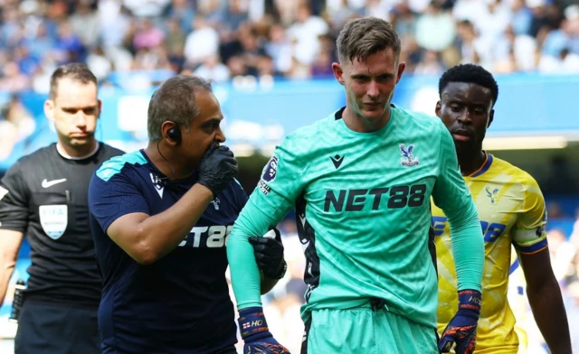 Dean Henderson receives medical attention