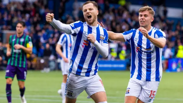 Bruce Anderson celebrates