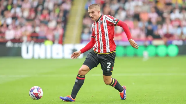 Alfie Gilchrist playing football