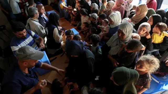 Palestinian children are vaccinated against polio, amid the Israel-Hamas conflict, in Deir Al-Balah