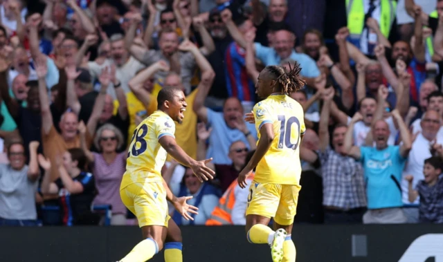 Crystal Palace's Eberechi Eze celebrates scoring their first goal with Cheick Doucoure