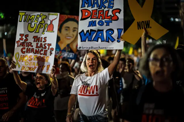 Protestors in Tel Aviv calling on the government to negotiate a deal to release the hostages in Gaza. Placards read "Make deals, not war!" and "Time's up! Is this their last chance? Hostage deal now!"