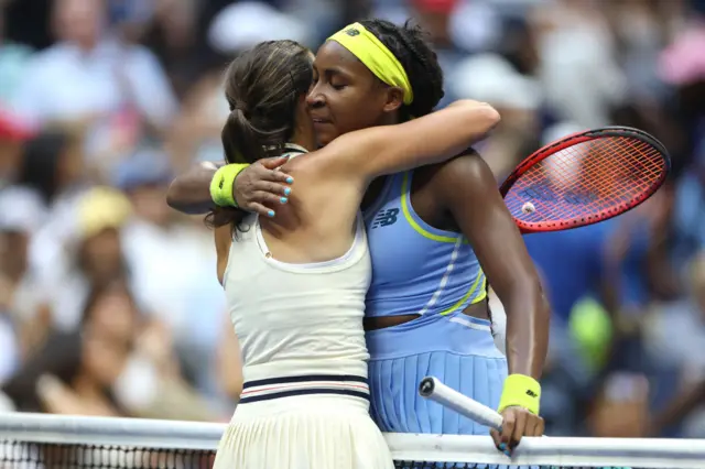 Emma Navarro and Coco Gauff hug at the net