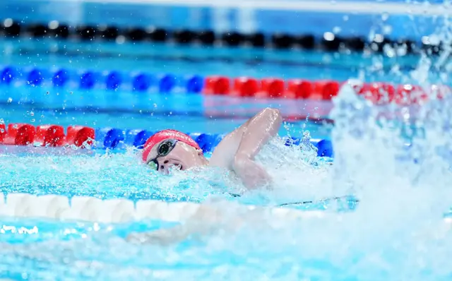 Brock Whiston intensely competing with one arm out the water