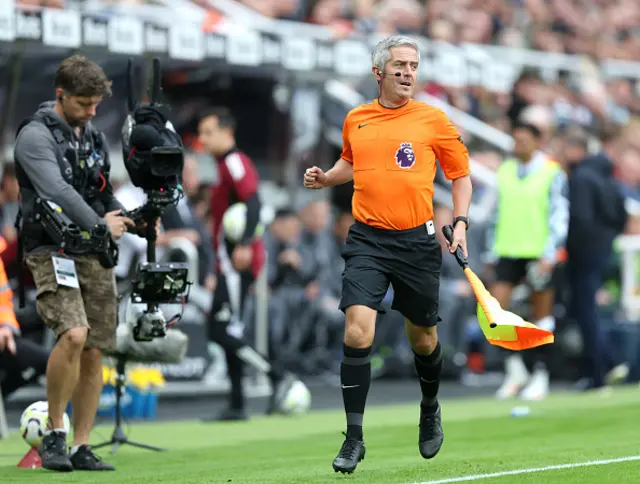 : Assistant Referee, Darren Bond, is seen running the line