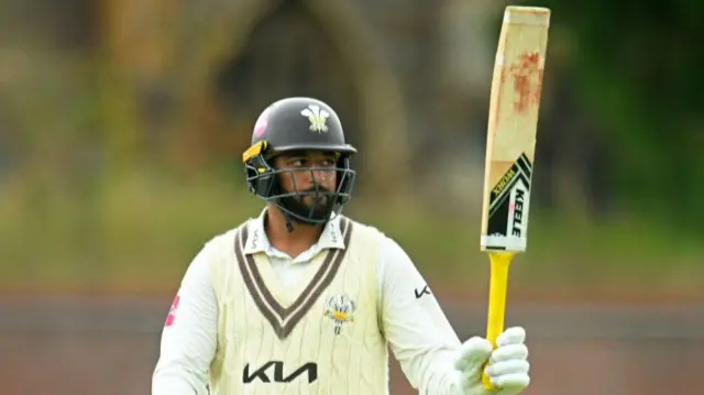 Ryan Patel of Surrey celebrates his half century