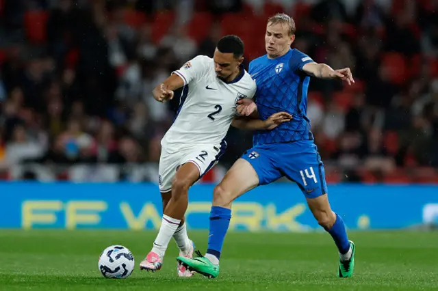 Trent Alexander-Arnold of England and Topi Keskinen of Finland challenge