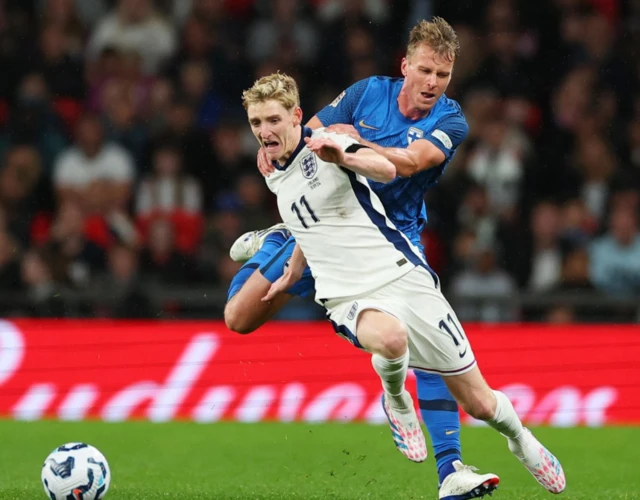 England's Anthony Gordon in action with Finland's Rasmus Schuller