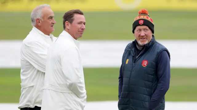 Umpires in conversation with Essex head groundsman Stuart Kerrison as rain falls during Essex CCC vs Nottinghamshire CCC