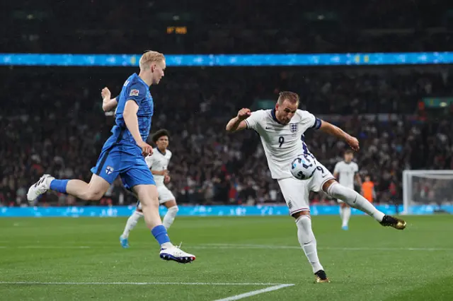 Harry Kane of England shoots on the volley