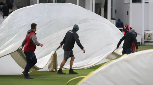 The covers are on in the lunch interval as light rain starts to fall during Kent CCC vs Hampshire CCC