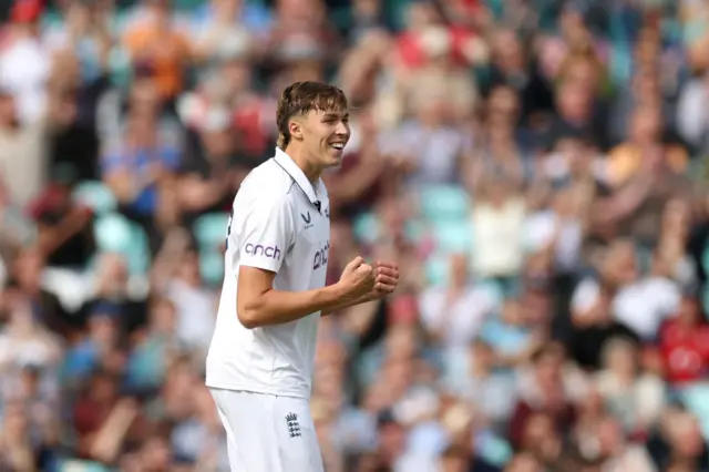 Josh Hull celebrates taking a wicket on his Test debut this week