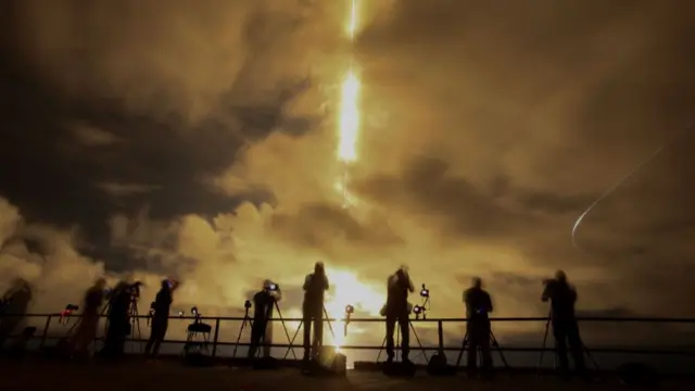 A slow shutter speed captures a streak of light from the engines on SpaceX's Polaris Dawn Falcon 9 rocket as it blasts off from Launch Complex 39A of NASA's Kennedy Space Center