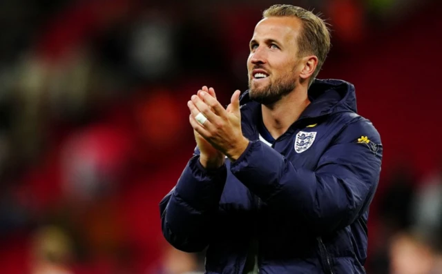 Harry Kane applauds the fans