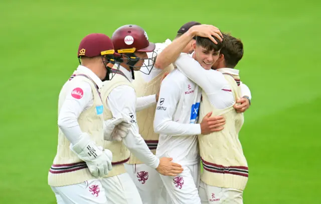 Archie Vaughan celebrates with Somerset team-mates