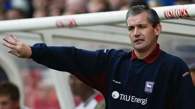 Ipswich manager George Burley signals to his players