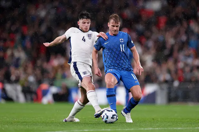 Declan Rice of England tackles Rasmus Schuller