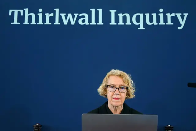 Lady Thirlwall sits under a sign saying 'Thirlwall inquiry'