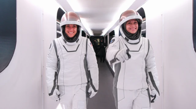 Sarah Gillis and Anna Menon in space suits