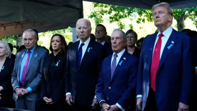 Kamala Harris and Joe Biden stand to the left of former New York City Mayor Michael Bloomberg, who separates the pair from former President Donald Trump