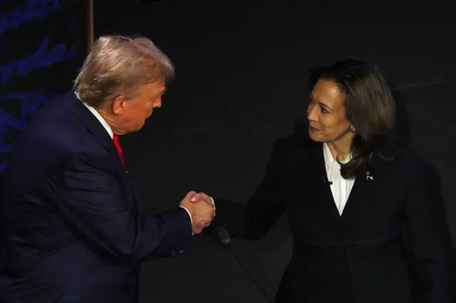 Harris and Trump shake hands