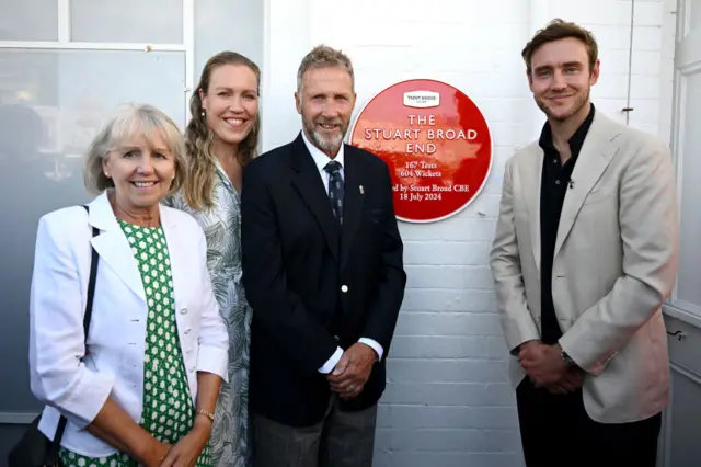 Stuart Broad smiles after opening the Stuart Broad End with his father Chris, mother Carole and sister Gemma