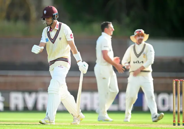 Brett Randell of Somerset makes his way off after being dismissed