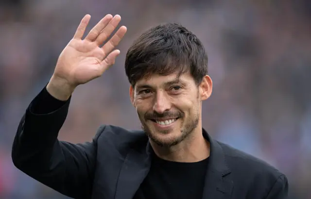 David Silva waving.