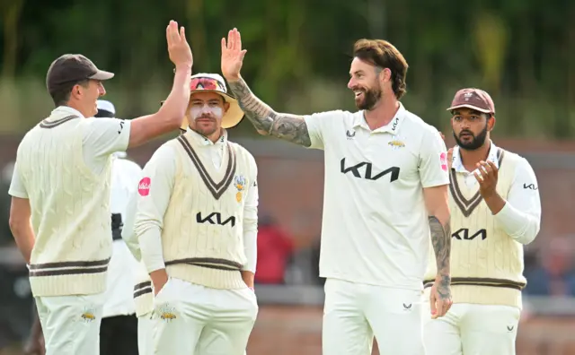 Jordan Clark of Surrey celebrates the wicket of Tom Lammonby