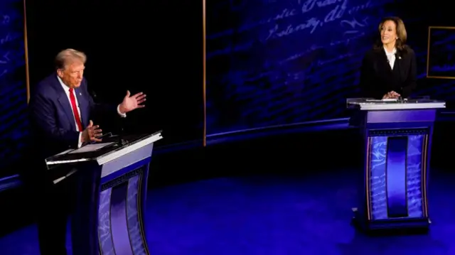 Trump and Harris behind podiums at the presidential debate