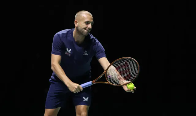 Dan Evans prepares to serve