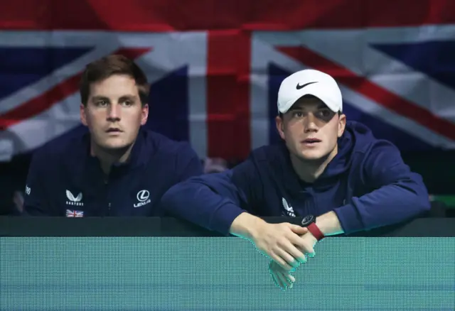 Henry Patten and Jack Draper of Great Britain watch on nervously