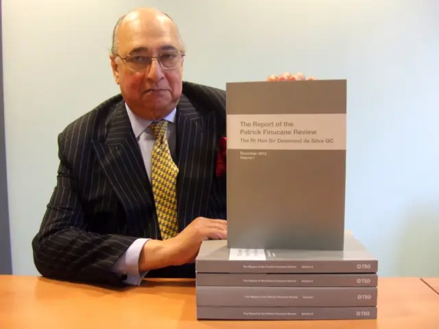 Sir Desmond de Silva holding up document entitled "The Report of the Patrick Finucane Review"