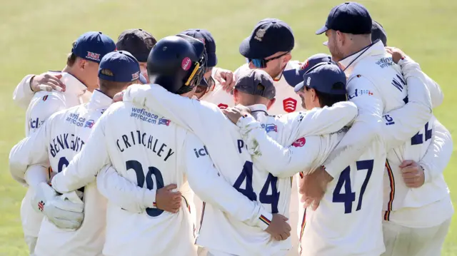 Essex players huddle