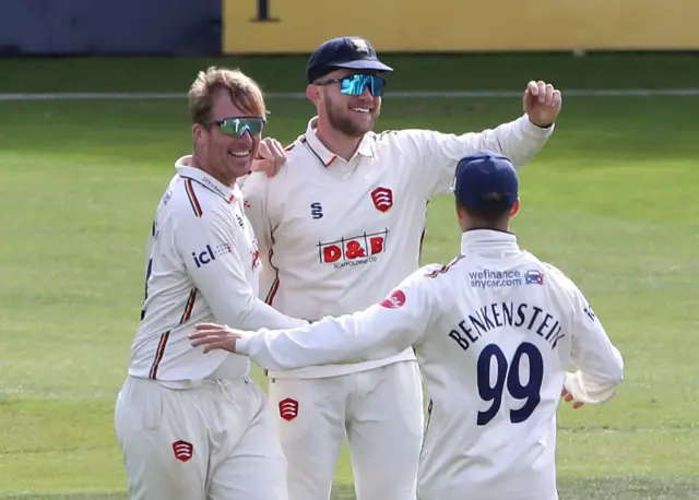 Simon Harmer celebrates with Sam Cook and Luc Benkenstein