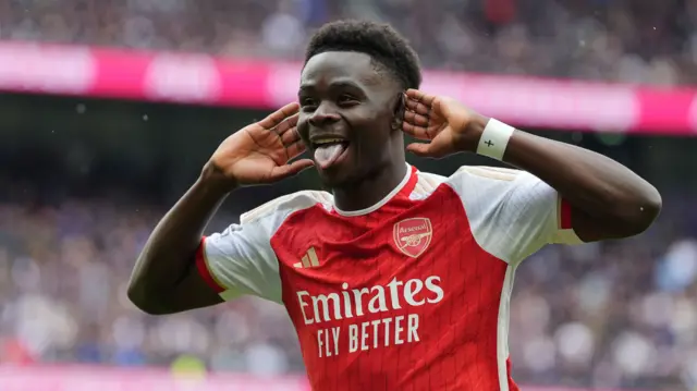 Bukayo Saka celebrates scoring a goal for Arsenal