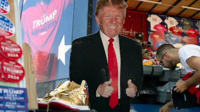 A vendor sells Trump merchandise at the Tucson rally