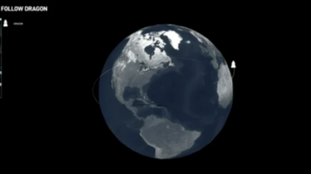 Earth with location of Dragon spacecraft