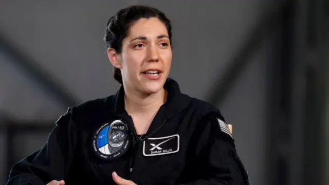 Crewmember Sarah Gillis of Polaris Dawn, a private human spaceflight mission, speaks at a press conference at the Kennedy Space Center in Cape Canaveral, Florida, U.S. August 19, 2024