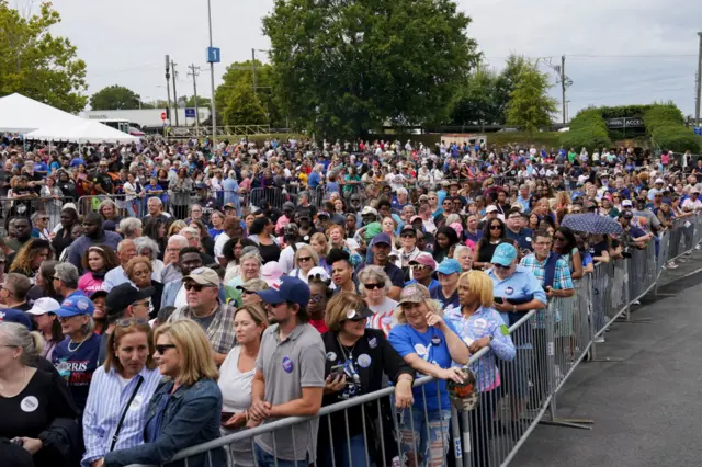 Attendees wait in line ahead of a campaign event for Harris