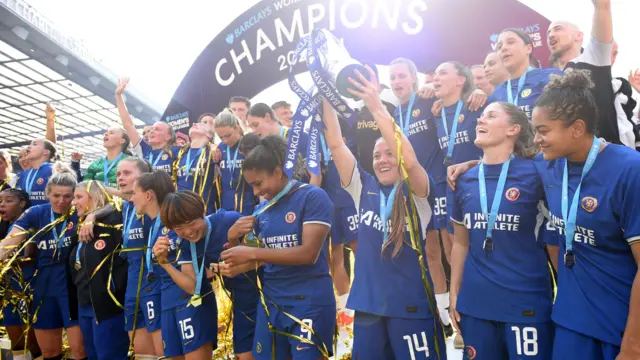 Chelsea players lift Women's Super League trophy in 2024