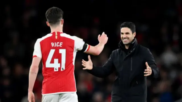 Arsenal manager Mikel Arteta celebrates with Declan Rice