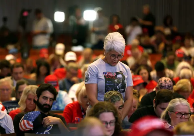 Supporters pray