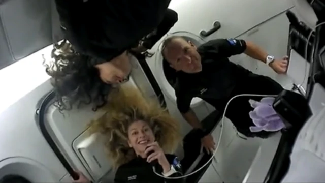 Anna Menon, Scott Poteet and Sarah Gillis in zero-gravity